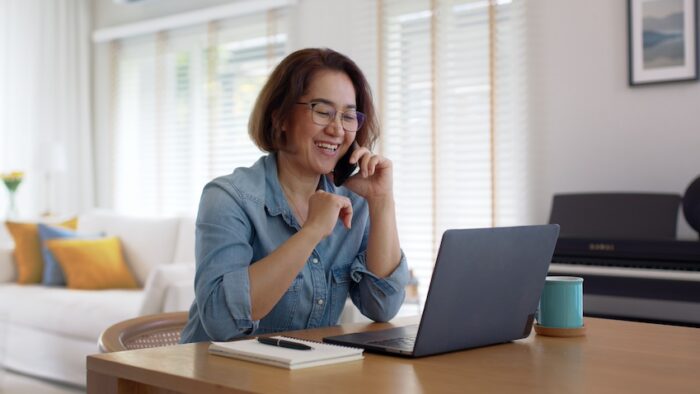 woman discussing murphy bed options on phone call