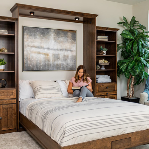 Woman reading in a Murphy Bed